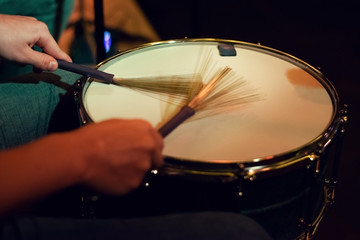 Drummer playing on a snare drum.