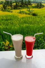Cold and fresh Watermelon and milkshake smoothies on the rice terraces field background