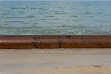 Big drain pipe on the beach