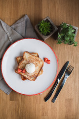 french toasts with an ice-cream and fresh berries 