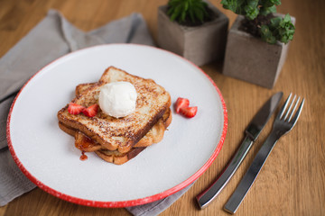 french toasts with an ice-cream and fresh berries 