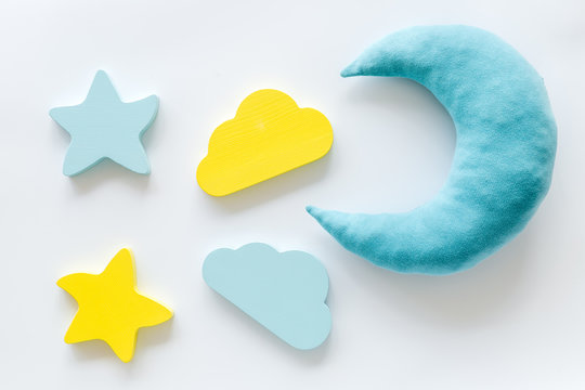 Night sleep concept with moon, stars, cloud toy on white background top view