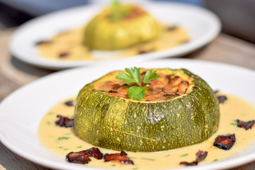 Tho Baked stuffed Courgettes served on the white wine sauce