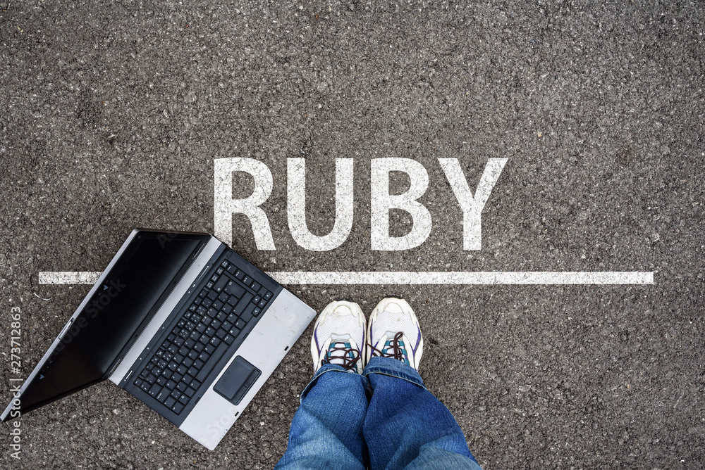 Aufkleber ruby programming language. man legs in sneakers standing next to laptop and word ruby