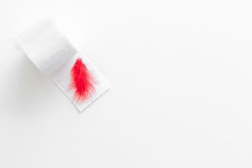 disease of colon concept with toilet paper roll on white background top view copy space
