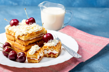 Breakfast, biscuit cake with cherries and milk