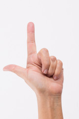 Close-up of a woman's hand and finger on white background