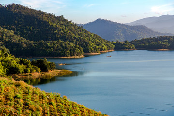 Fototapeta na wymiar Panoramic landscape of beautiful big lake among green mountains on the road to Dalat in Vietnam