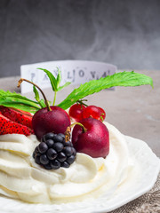 Pavlova: A Cake Made From Layers of Meringue, Whipped Cream, and Fresh Berries