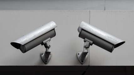 two security cameras looking in opposite directions