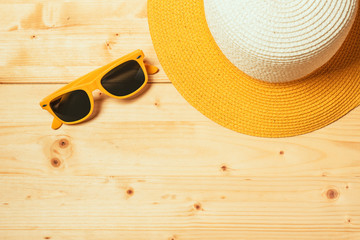 Straw hat and sunglasses in summer holiday concept
