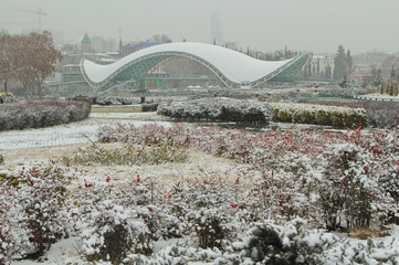Winter view of Tbilisi with Bridge of Peace while snow. Old town Sololaki. Georgia Country.