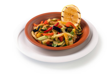 grilled vegetables salad on plate, vegan of various vegetables isolated on white background