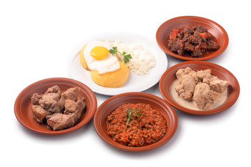 Traditional dish in Moldova. Hominy served with meat, eggs and cheese.