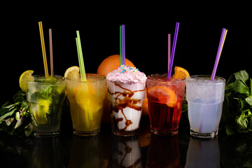 refreshing summer cocktails over black background