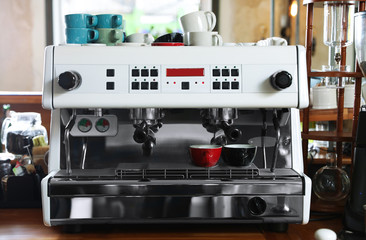 Modern coffee machine on bar counter in cafe