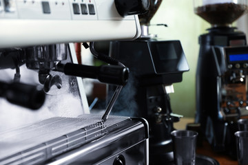 Modern coffee machine in cafe, closeup. Space for text
