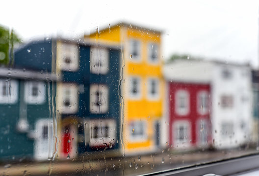 Rain Drops On Windows With Jellybean Houses In St. John's, Newfoundland