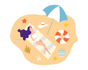Girl lying on beach in a sweemsuit and a hat. Girls relax on the beach.