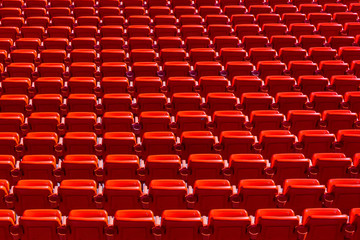 Fototapeta premium Abstract Geometric Background of Red Seats in Empty Sports Stadium