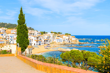 Fototapeta na wymiar View of Calella de Palafrugell, scenic fishing village with white houses and sandy beach with clear blue water, Costa Brava, Catalonia, Spain
