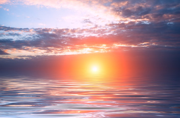 Obraz na płótnie Canvas Bright sun and sunset with clouds over the sea on a calendar.