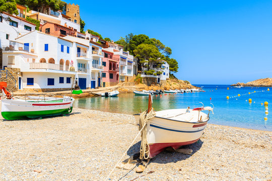 Traditional fishing boats on beach in Sa Tuna coastal village, Costa Brava, Spain