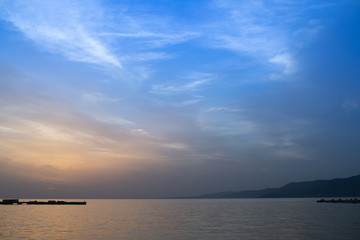Fototapeta na wymiar sunset over the sea blue sky