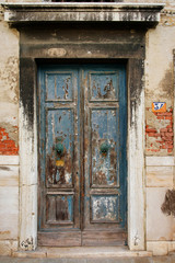 Fototapeta na wymiar Old blue wooden door