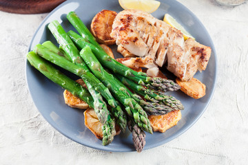 Fried cod fillet with green asparagus