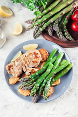 Fried cod fillet with green asparagus