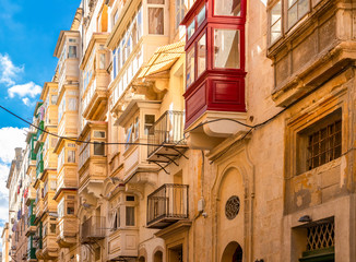Maltese streets and colorful wooden balconies in Valletta, Malta
