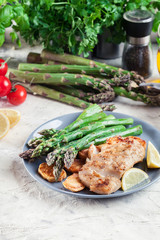Fried cod fillet with green asparagus