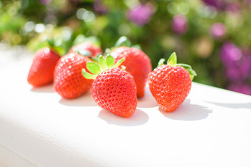 Fresh strawberries on a light background.