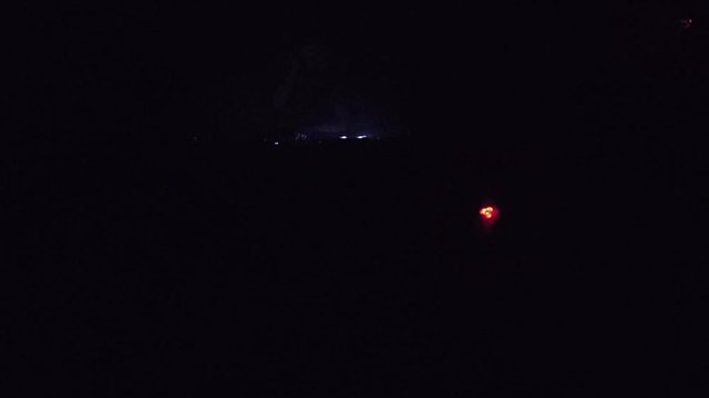 Three guys dancing in psychedelic trance underground club concert in strobe light 