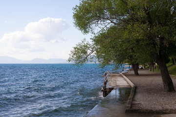 Fototapeta na wymiar View of an empty beach with trees on spring.