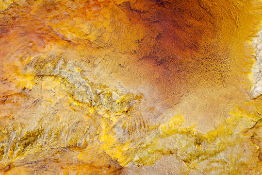 From above beautiful orange streams and transitions on rock in Mines of Riotinto Huelva
