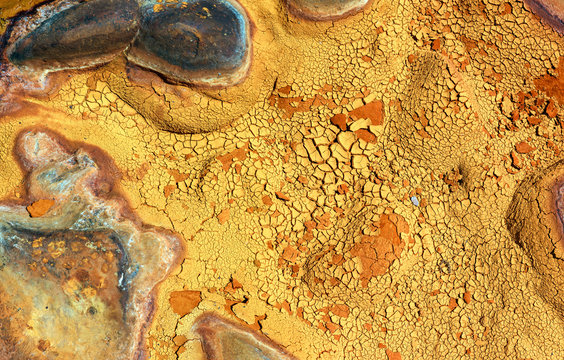 From above beautiful orange streams and transitions on rock in Mines of Riotinto Huelva