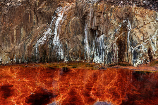 From above beautiful orange streams and transitions on rock in Mines of Riotinto Huelva