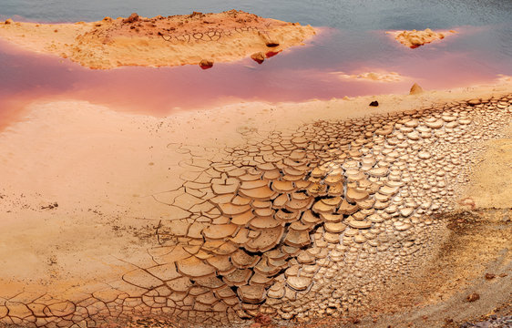 From above dry brown rock surface in cracks