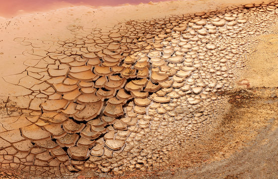 From above dry brown rock surface in cracks