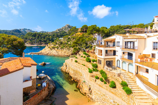 View of beach and holiday apartments in Fornells village, Costa Brava, Spain