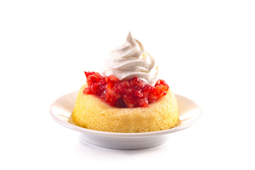 A Single Serve Strawberry Shortcakes with Strawberry Sauce and Whipped Cream