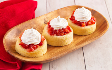 A Single Serve Strawberry Shortcakes with Strawberry Sauce and Whipped Cream