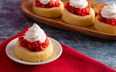 A Single Serve Strawberry Shortcakes with Strawberry Sauce and Whipped Cream