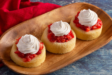A Single Serve Strawberry Shortcakes with Strawberry Sauce and Whipped Cream
