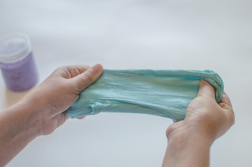 slimes in the hand of a child