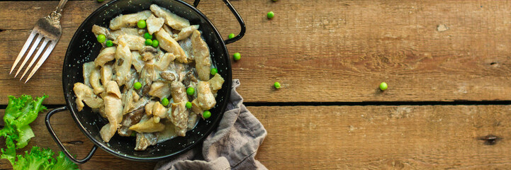 chicken meat with mushrooms in a creamy sauce - snacks. healthy food and menu. copy space