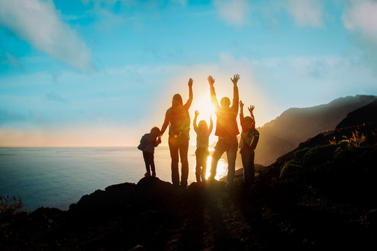 Big Family With Kids Travel In Mountains At Sunset