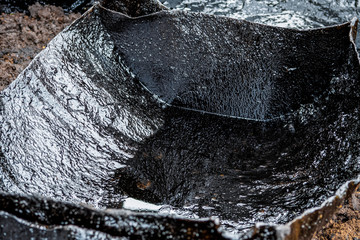Dirty Oil spill on floor. Oil pollution.